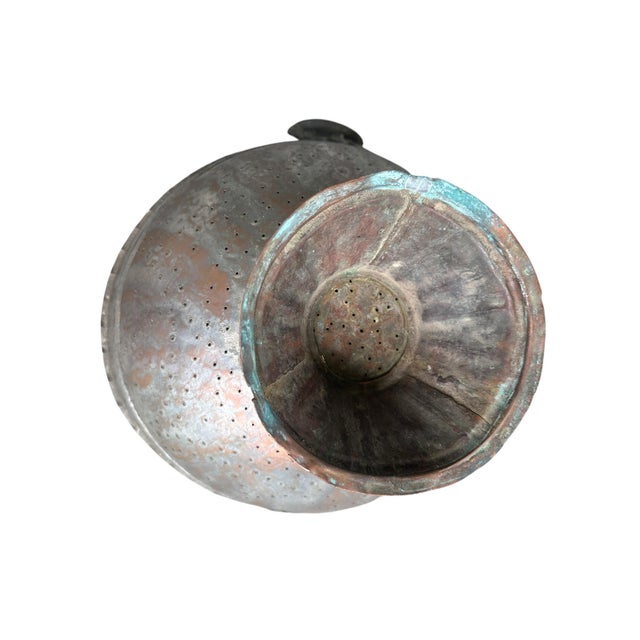 An exceptional and wonderfully scaled late 19th-century Ottoman footed colander, hand-hammered from heavy-gauge copper....
