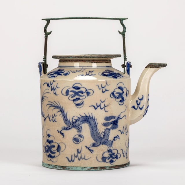 Blue and white vintage Asian teapot featuring a dragon motif and beautiful copper handle with patina. Lid is removable,...