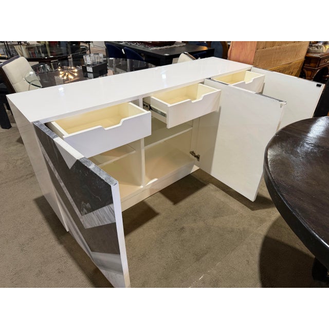 Make a dramatic statement with the Bernhardt Meridian Stone Front Credenza, an extraordinary blend of modern artistry and...