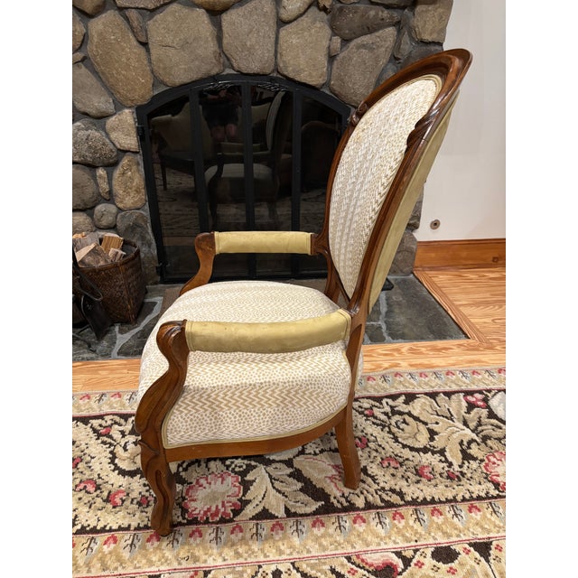 Victorian-style armchair known as a balloon-back or medallion-back chair. From the 19th century (but more recently...