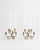 A pair of petite, six-arm brass candelabra by pioneering Austrian-Swedish architect and designer Josef Frank for Firma...