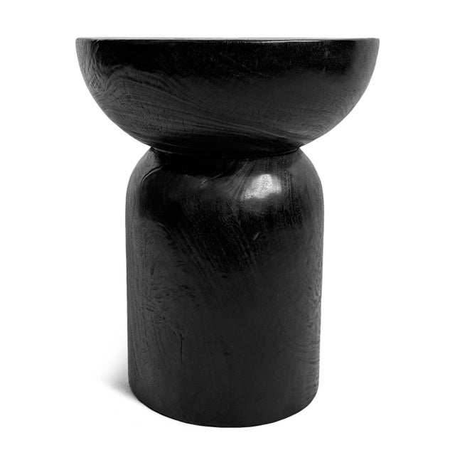 Solid wood stool / side table. Sleek black finish and modern simple round cork design. Each will vary in natural wood...