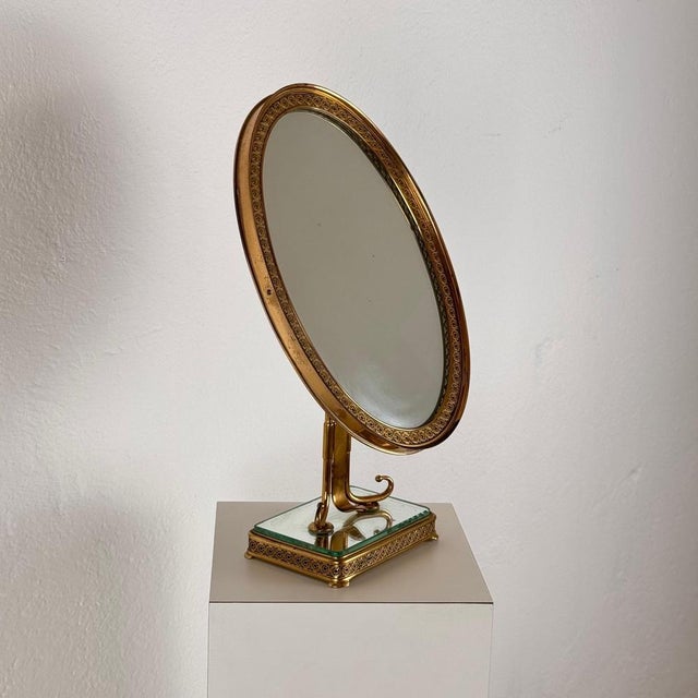 An exceptional Italian vanity mirror from the 1940s, designed by Pier Luigi Colli, showcasing exquisite craftsmanship and...