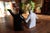 A pair of modern ceramic salt and pepper shakers designed as stylized human figures, executed in contrasting black and...