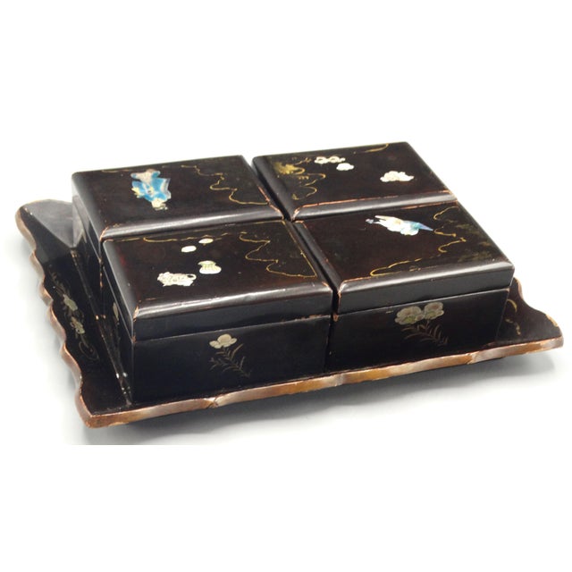 A 19th-Century Chinese Export lacquered games box and tray. It is handcrafted of papier-mâché and beautifully hand inlaid...