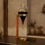 An iconic Carl Auböck II decanter and sculptural stand, designed and produced by the Auböck Werkstätte in Vienna, Austria,...
