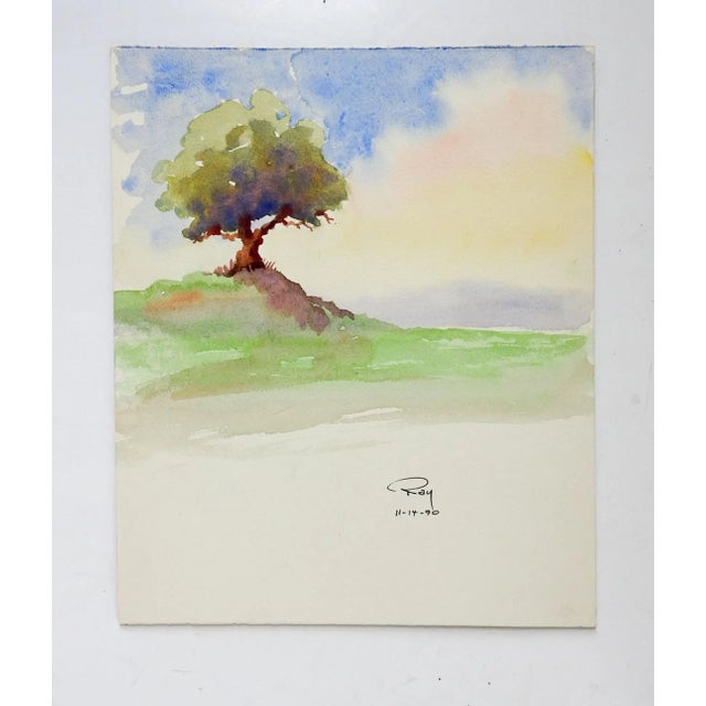 Watercolor on artist board impressionist painting of landscape with lone tree. Signed Ray 1990 bottom margin. Unframed.