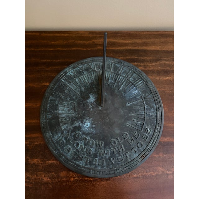 A stunning vintage iron verdigris garden sundial reading "Grow old along with me. The best is yet to be." USA, Late 20th...