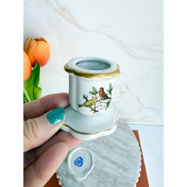 A charming pair of miniature Herend candlesticks in the beloved Rothschild Bird pattern, each hand-painted with delicate...