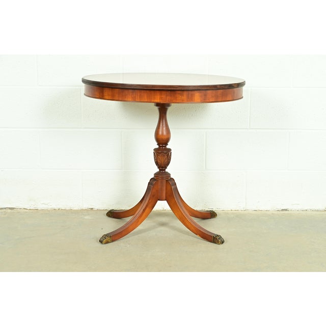 A gorgeous Georgian or Regency style pedestal side table or tea table By Imperial Furniture USA, Circa 1940s Mahogany,...