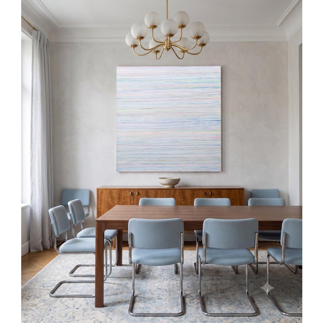 A modern color-field painting on canvas in tones of white and pastels.