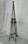 A hand forged wrought iron garden obelisk or trellis. Crafted with twisted iron uprights, decorative scrollwork, and...