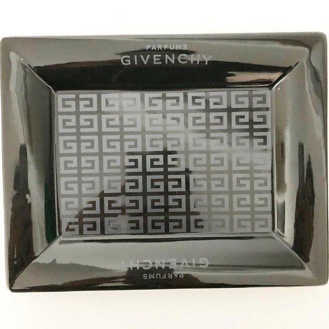 GIVENCHY Black ceramic ashtray with vintage logo -art- Year: 1980 by Givenchy Materials: black ceramic Conditions: Perfect...