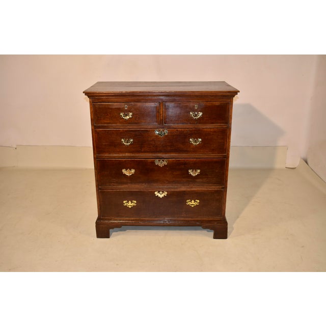 PERIOD George III oak and mahogany chest of drawers from England. This lovely piece has a two board top, the boards being...