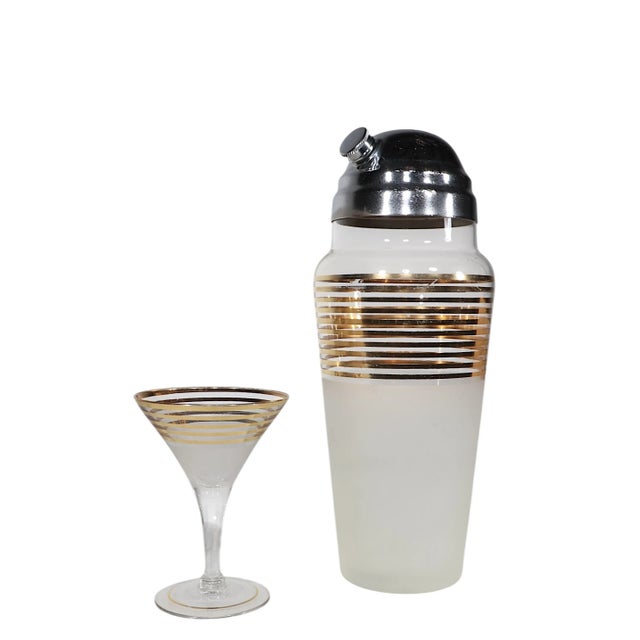 Chic Art Deco, Mid Century style cocktail set by Derby Shelton circa 1940's. The set features six gold band trumpet form...