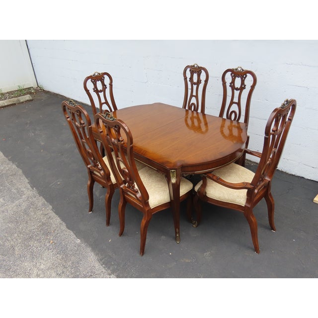 This classic Set of Dining Table, two leaves, and Six Chairs is made of wood, solid wood, mahogany, cherry, veneer, flame...