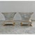 A refined pair of reticulated porcelain baskets, executed in a neoclassical idiom with delicate openwork and restrained...