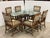 Design Plus Gallery presents a Vintage Dining Set from McGuire Furniture. The table pairs an oval beveled glass top with a...