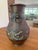 A striking example of Meiji-period Japanese metalwork, this bronze hu-form vase marries the weight and gravitas of ancient...