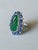 2020s Set in 18k Gold, Carved Zambian Emerald, Blue Sapphires & Diamonds Cocktail Ring, Size 6 For Sale - Image 5 of 9