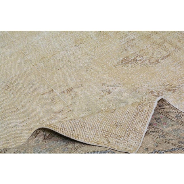 Hand-knotted with care using traditional rug-making techniques, this wool rug blends timeless craftsmanship with a modern...