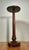 This is a vintage, decorative, Mid Century solid walnut plant stand or pedestal table. Features a simple flat circular...
