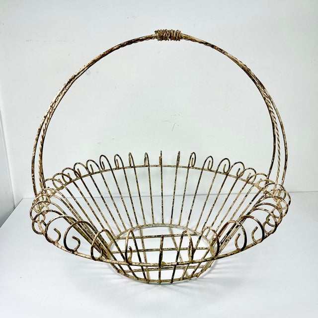 Vintage Home is pleased to present this vintage French Art Nouveau Iron Basket Jardiniere Planter. We curated this...