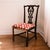 A characterful Chippendale style side chair with an elaborate openwork back, scrolling details, a shaped crest rail, and a...