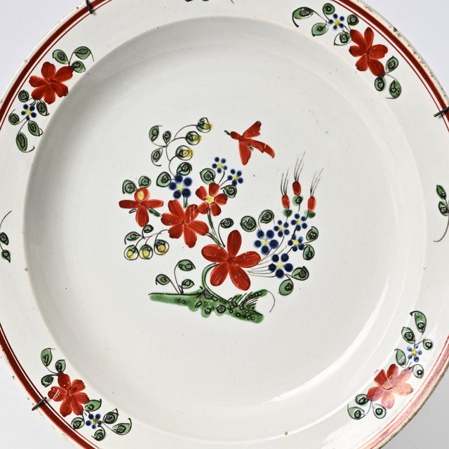 Antique, hand-painted faience plate from Boch Luxembourg. Made circa 1800. Sold with the vintage wire hanger. I have...