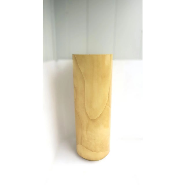 A cylindrical goatskin parchment-clad pedestal column, in the Modern style Postmodern Period, in the manner of design Karl...