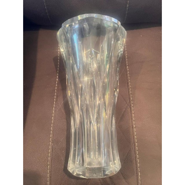This exquisite crystal vase by Baccarat is characterized by its deep, vertical, leaf-like cuts that create a sense of...