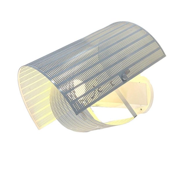 An iconic piece of Italian postmodern design, the Shogun wall lamp was created in the 1980s by renowned Swiss architect...