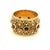 A substantial vintage 14K yellow gold and ruby wide band ring, circa 1970, designed in the Etruscan Revival tradition. The...