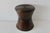 Sculptural bamboo pedestal side table featuring an hourglass bowtie shape, vertically bamboo reeds, cinched at the center,...