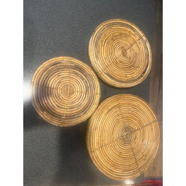 These are in mint condition!!!! 3 vintage round rattan and pencil reed trays featuring distinctive brass rims, styled in...