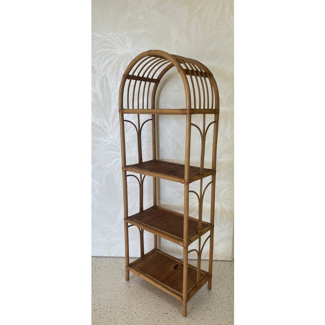 Beautiful 1960s Italian Mid-Century Modern étagère or bookshelf or cupboard in rattan wicker bamboo. The organic beauty of...