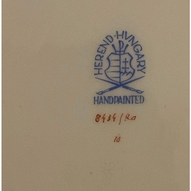 A beautifully executed set of four Herend porcelain dessert plates in the celebrated Rothschild Bird pattern, featuring...