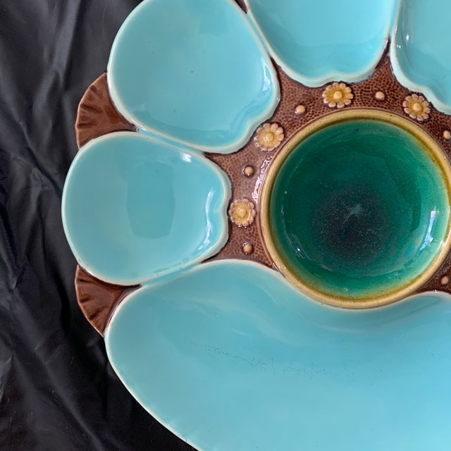 This is a 19th-century Minton Majolica turquoise and green oyster plate, featuring six shell-shaped wells, a larger...