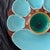 This is a 19th-century Minton Majolica turquoise and green oyster plate, featuring six shell-shaped wells, a larger...