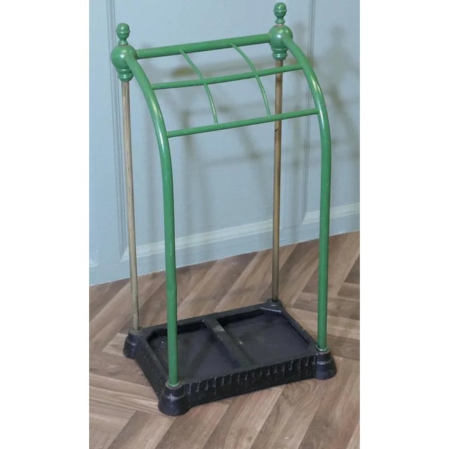 A Victorian Brass and Cast Iron Walking Stick Stand or Umbrella Stand A charming piece it has an unusual curved shape to...