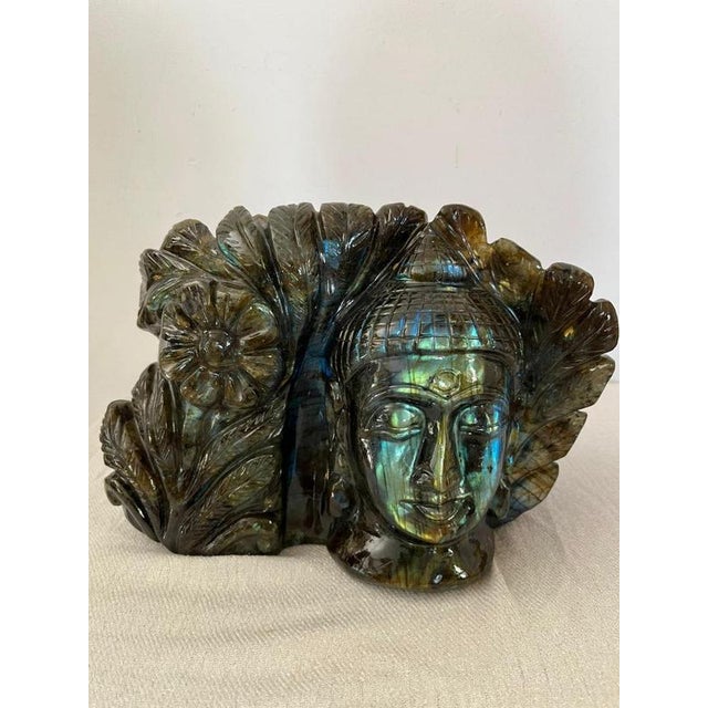 Beautiful and rare sculpture of the Buddha`s face in Labradorite (origin Madagascar). This piece has the particularity of...