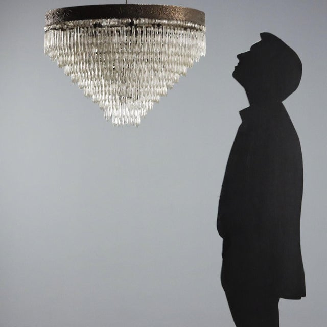 Seven-light Empire-style chandelier. Metal frame with leaf and squirrel motifs, clear glass pendants. Italy, early 20th...