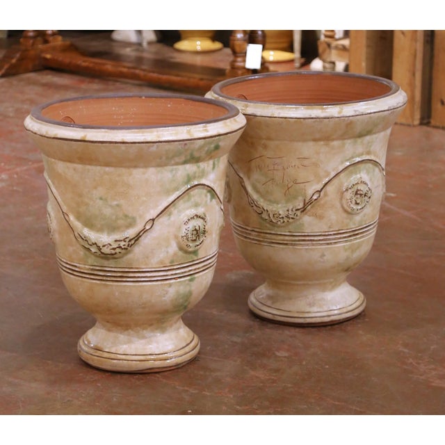 This impressive pair of French Anduze terracotta garden vases originates from Anduze, a historic pottery center celebrated...