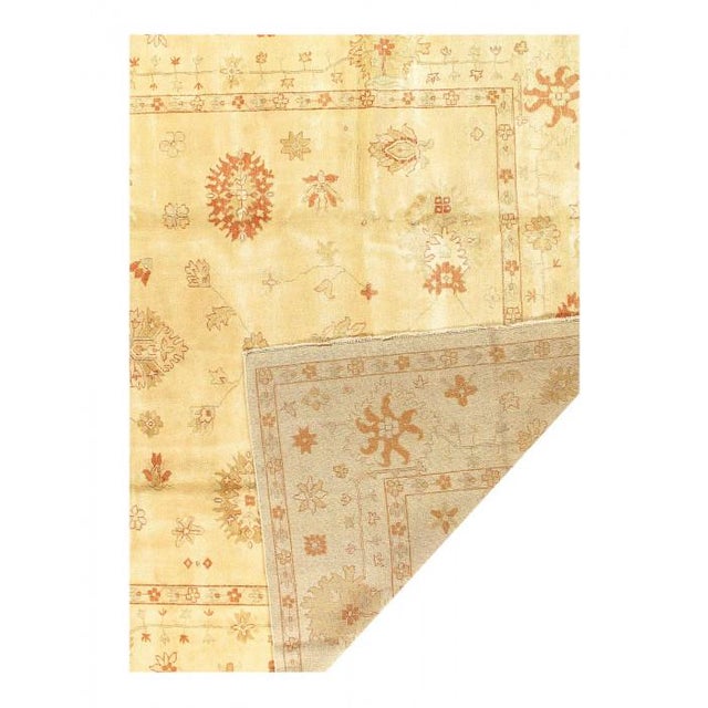 This Oushak Hand-Knotted Wool Gray Area Rug celebrated for its understated elegance, is greatly influenced by original...