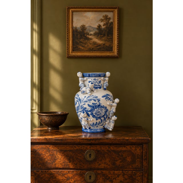 Vintage Chinese blue-and-white porcelain Fertility Boys vase featuring sculptural applied figures of boys climbing around...
