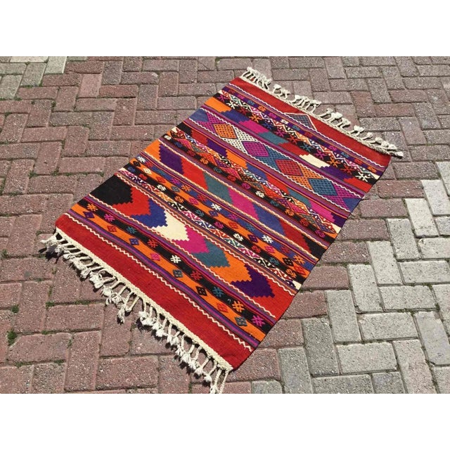 This beautiful, vintage, handwoven kilim is approximately 60 years old. It is handmade, of very fine quality hand spun...