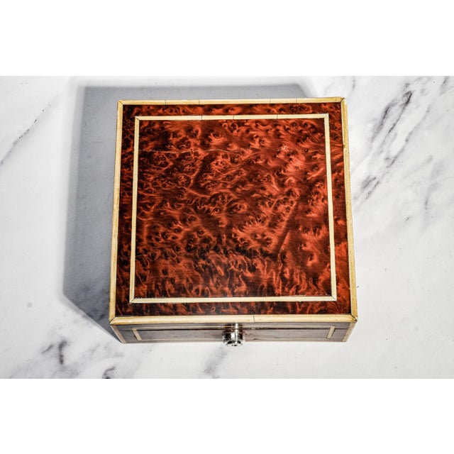A superb example of Edwardian English craftsmanship, this exceptional antique burl wood box combines luxurious materials,...