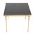 A high-quality vintage french coffee or side table featuring a brass base and a black smoked-glass top; designed entirely...