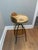 Beautiful set of two swival bar stools featuring hand- carved solid wood seats with a warm , natural finish and low...