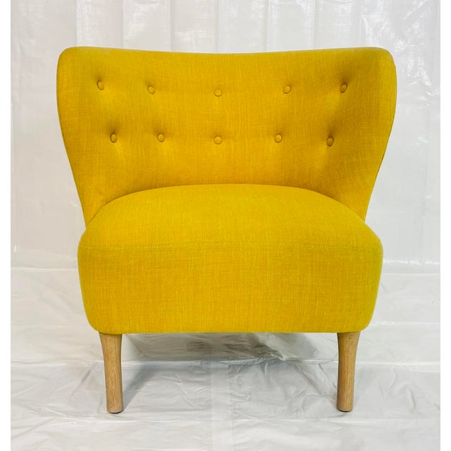 Striking postmodern lounge chair attributed to Decca Furniture Ltd., upholstered in vibrant golden yellow textured tweed...